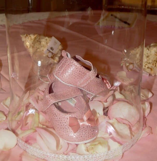 pink shoes in glass contianer